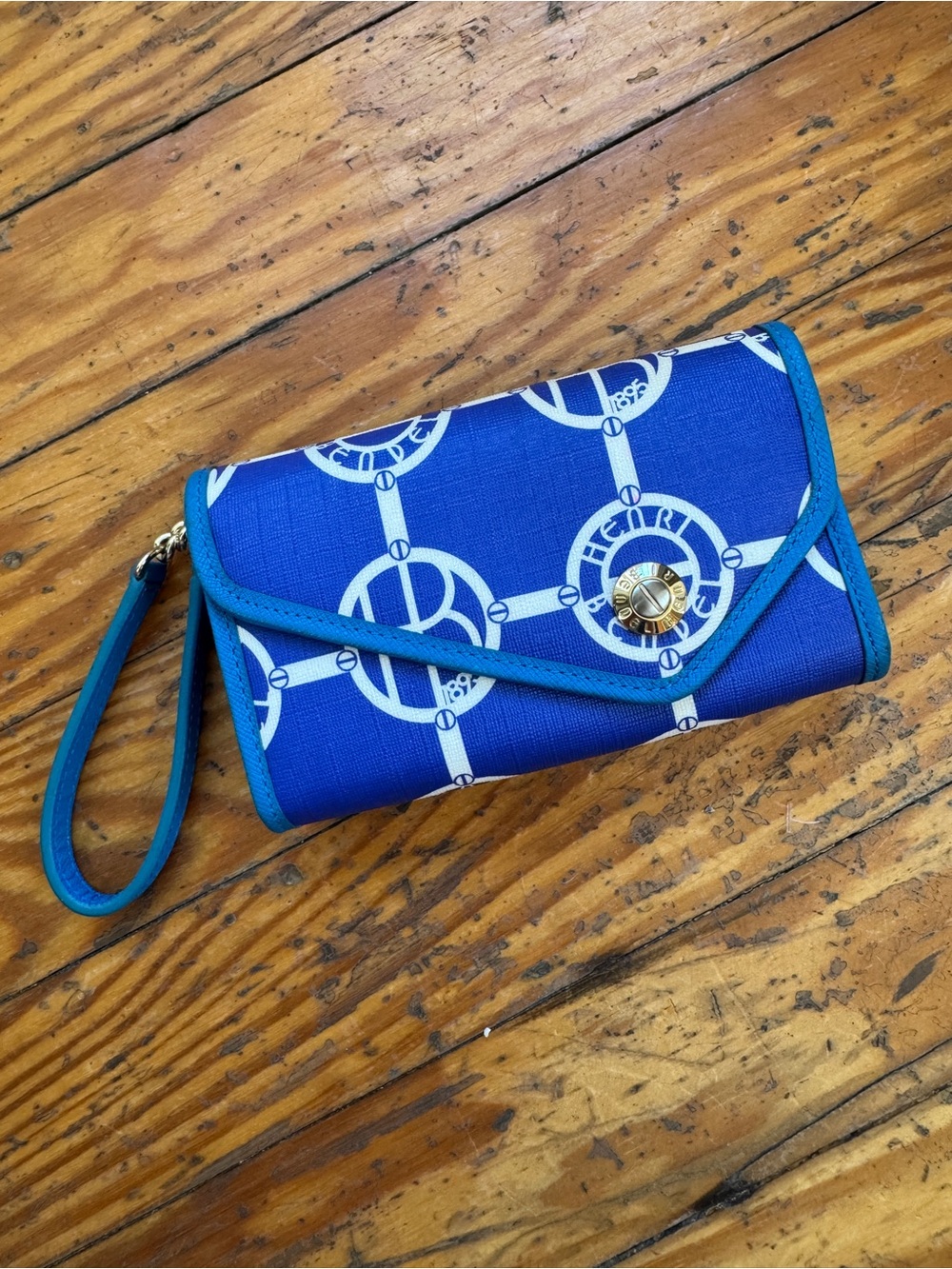 Blue and white Henry Bendel wallet with wrist strap